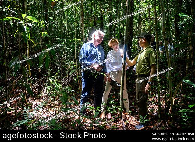 dpatop - 18 February 2023, Malaysia, Kuching: German President Frank-Walter Steinmeier (l-r) and his wife Elke Büdenbender are guided through a jungle in...
