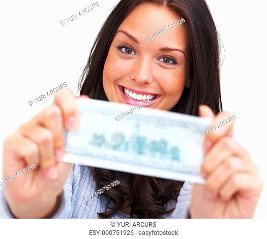 Portrait of pretty young woman showing a money note on white background