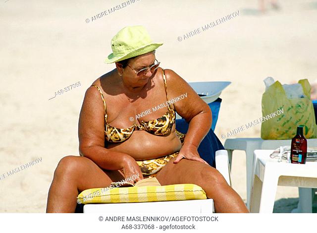 Woman on the beach at Jebel Ali. Dubai. UAE