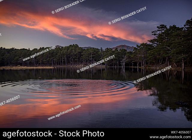 Red sunset in Bassa d'Oles lakes (Aran Valley, Catalonia, Spain, Pyrenees)