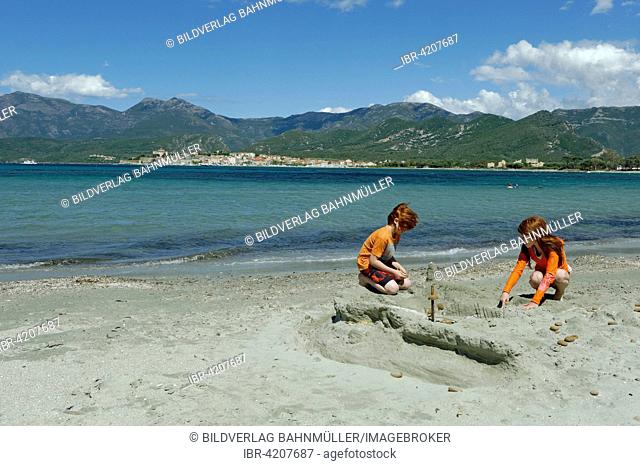 Children playing on the beach and bay of Saint Florent, Haute-Corse, Nebbio, North Coast, Corsica, France