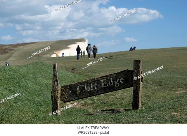 A warning sign near the cliffs at Beachy Head on the south coast, South Downs National Park, East Sussex, England, United Kingdom, Europe