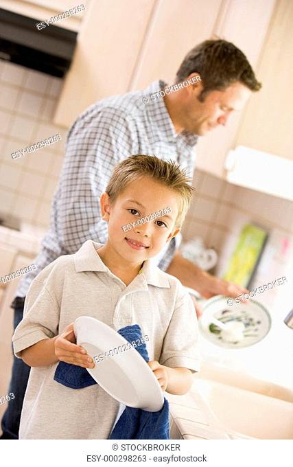 Father And Son Cleaning Dishes