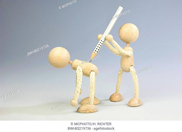 two wooden figures, one attacking the other from behind with a pencil