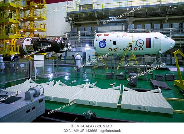 The Soyuz MS-02 spacecraft is seen after being rotated into a horizontal position in preparation for encapsulation in its fairing on Thursday, Tuesday, Oct