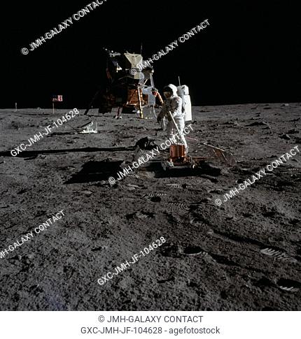 The deployment of the Early Apollo Scientific Experiments Package (EASEP) is photographed by astronaut Neil A. Armstrong, Apollo 11 commander