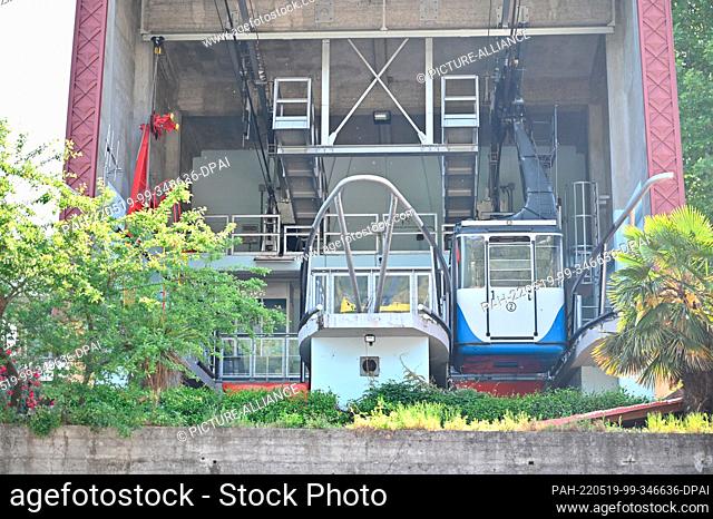 PRODUCTION - 11 May 2022, Italy, Stresa: Gondola number two stands in the bottom station of the Stresa-Mottarone cable car