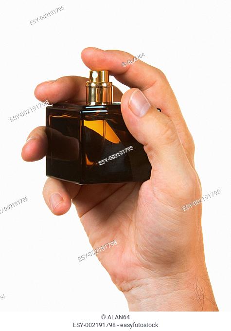 bottle of cologne in his hand