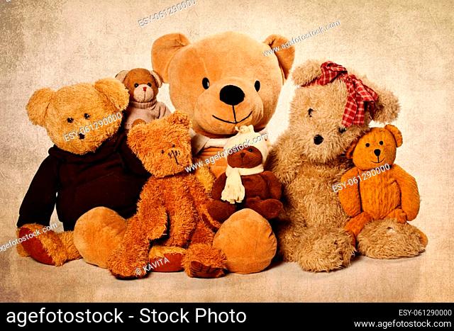 Cute Teddy bear on the grunge background