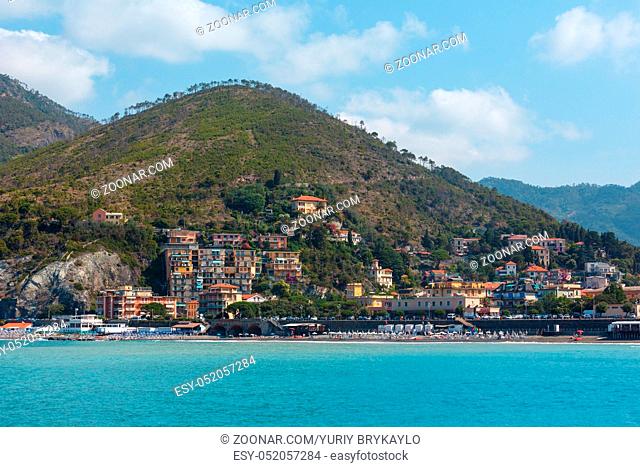 Beautiful summer Levanto village coast view from excursion ship. Right near famous Cinque Terre National Park in Liguria, Italy. People unrecognizable