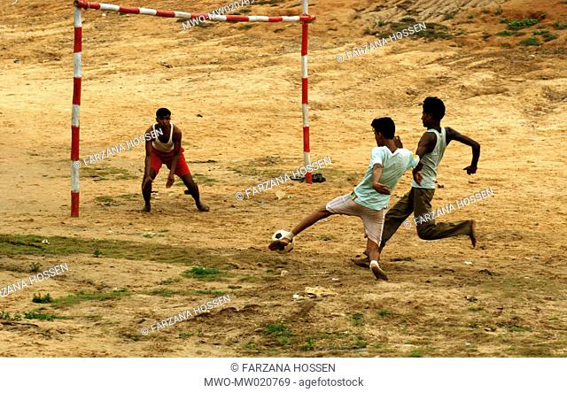 Young men playing football in the morning in Rangamati, the hill district of Chittagong Bangladesh June 12, 2009