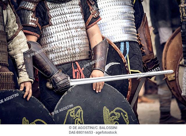 Warrior with lamellar armour, shield and sword, Festival of Slavs and Vikings, Centre of Slavs and Vikings, Jomsborg-Vineta, Wolin island, Poland