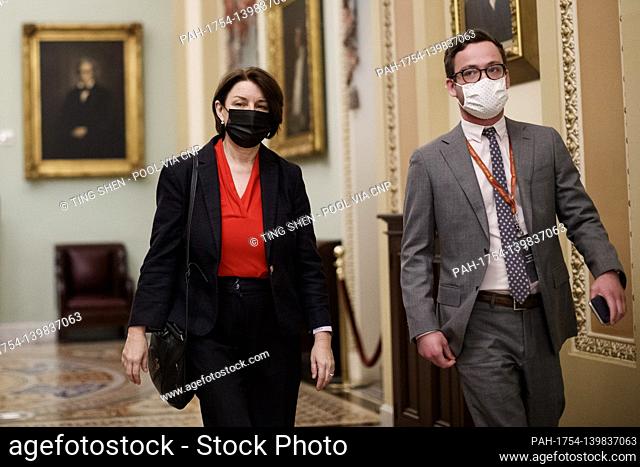 Senator Amy Klobuchar, a Democrat from Minnesota, wears a protective mask while walking through the U.S. Capitol in Washington, D.C., U.S