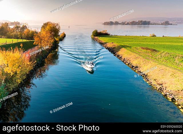 Rapperswil, SG / Switzerland - November 5, 2018: motorboat with tourist people passes from the lower to the upper Lake Zurich through the locks and passage on...