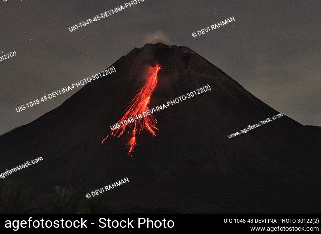 Lava flows down from the crater of Mount Merapi, Indonesia's most active volcano, as seen from South Kaliurang village in Magelang, Central Java on January 3