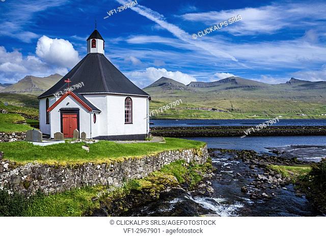 Small village church with cemetery in Faroe Islands, Denmark