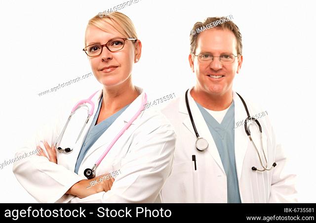 Smiling male and female doctors or nurses before a white background