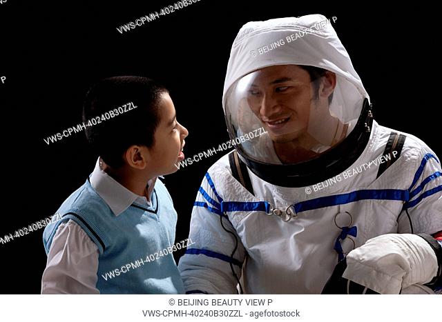 Boy and astronaut face to face