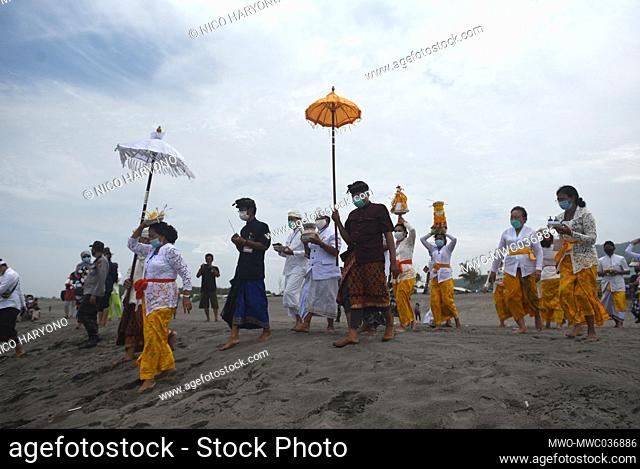 People in Yogyakarta carry out the Melasti ceremony, adhering to various health protocols due to Covid 19. Melasti is a Hindu Balinese purification ceremony and...
