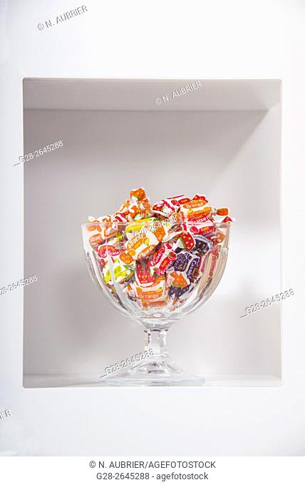 Glass cup full of colored sweets