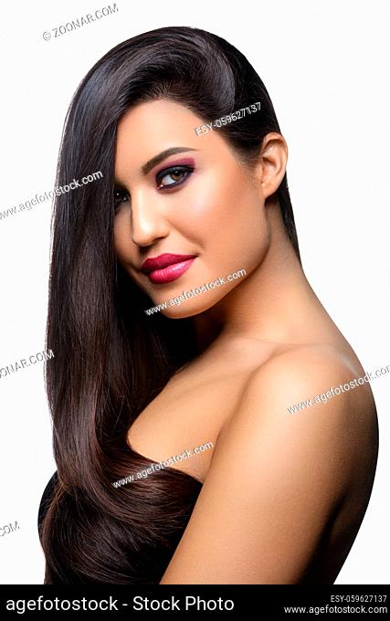 beautiful young woman with long healthy shiny hair. black color. copy space