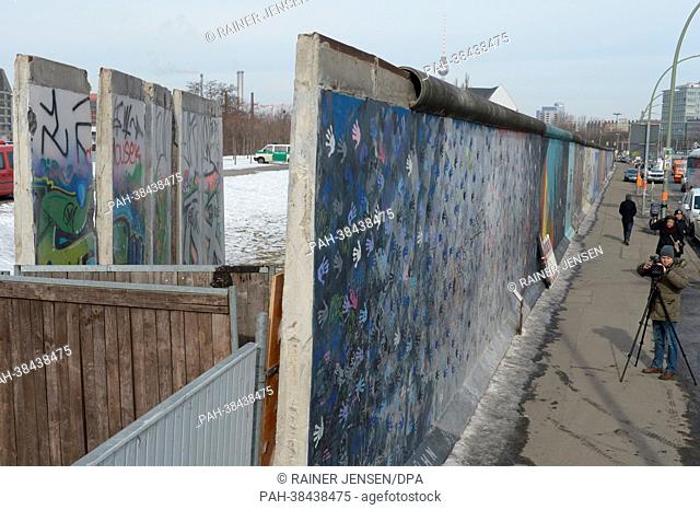 Four elements of the former Berlin Wall are visible on the left of the actual border line, after being removed from the East Side gallery in Berlin, Germany