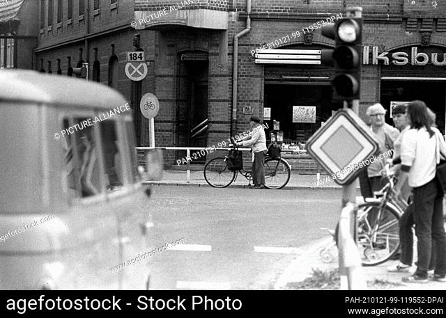 15 September 1983, Saxony, Delitzsch: Cyclist at a street crossing. Street scene in the district town of Delitzsch. Exact date of recording not known