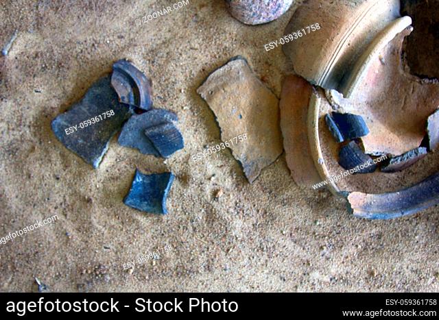 Science. Classical archaeology. Stucco and pottery ceramics 10-11 century from Slavic (and Vikings) old settlement (Izborsk, Russia), clay pot, earthen pot