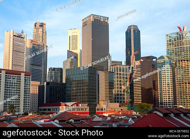 Singapore, Republic of Singapore, Asia - Cityscape over the roofs of the historic shophouses in Chinatown with modern skyscrapers in the central business...