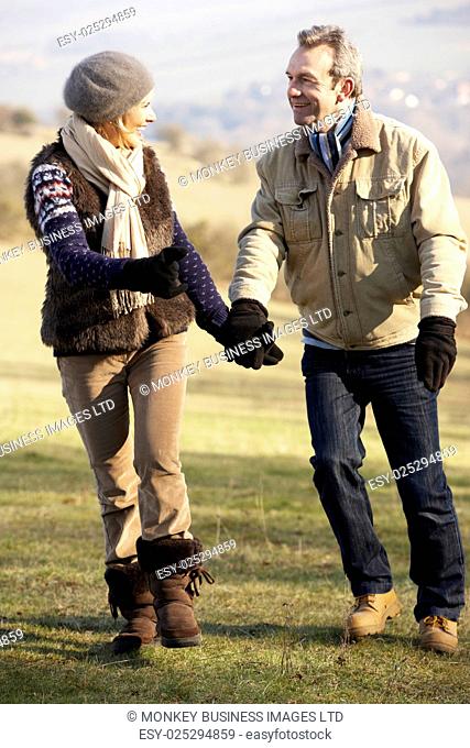 Mature couple on country walk in winter