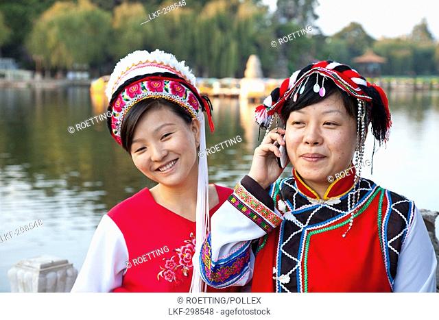Portrait of two Chinese women wearing traditional costumes, Bai minority, Dianchi Lake, Daguan Park, north-west of Kunming City, Kunming, Yunnan
