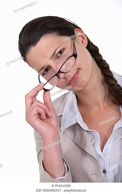 Woman peering over her glasses