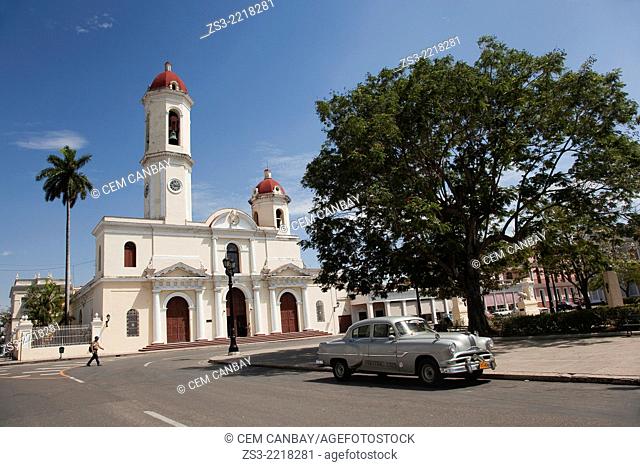 Purisima Concepcion Cathedral in Jose Marti Park with an old American car in the foreground, Cienfuegos, Cuba, West Indies, Central America