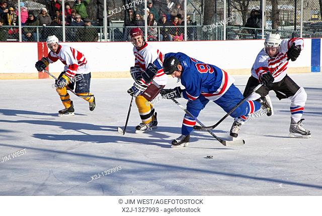 Detroit, Michigan - Members of the Detroit Police Department play ice hockey against Detroit Firefighters as a fundraiser for the Clark Park Youth Hockey...