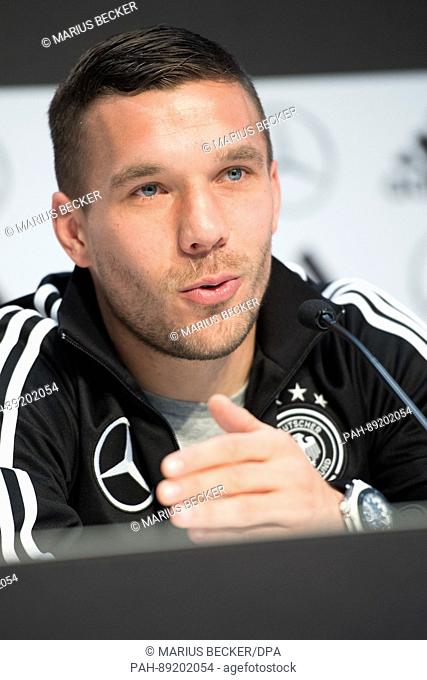 Lukas Podolski speaks during a press conference of the German national soccer team in Dortmund, Germany, 21 March 2017. The German national team will meet...