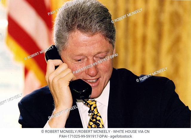 United States President Bill Clinton telephones Mayor Ronald Norick of Oklahoma City, Oklahoma from the Oval Office of the White House in Washington