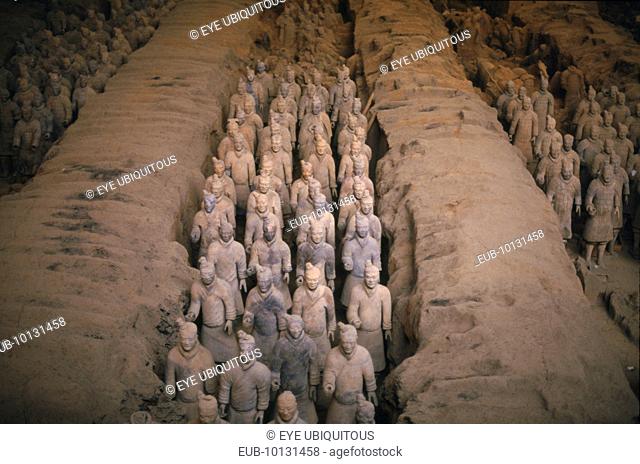 Terracotta warriors in rows in pits at original excavation