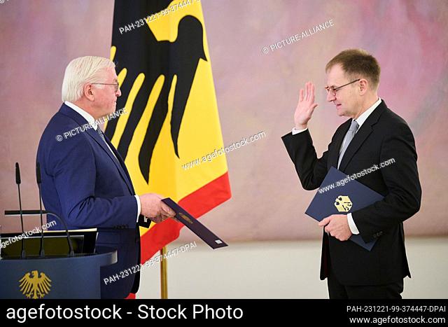 21 December 2023, Berlin: Frank-Walter Steinmeier (l), Federal President, swears in Peter Frank, judge of the Federal Constitutional Court, at Bellevue Palace