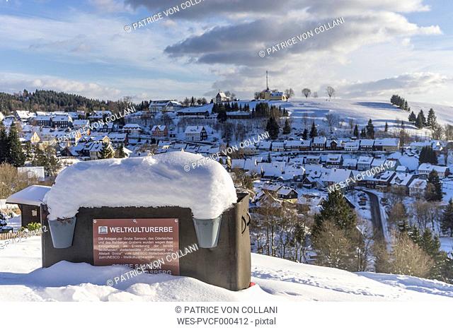 Germany, Lower Saxony, townscape of Sankt Andreasberg and tipper wagon of Samson Pit in winter