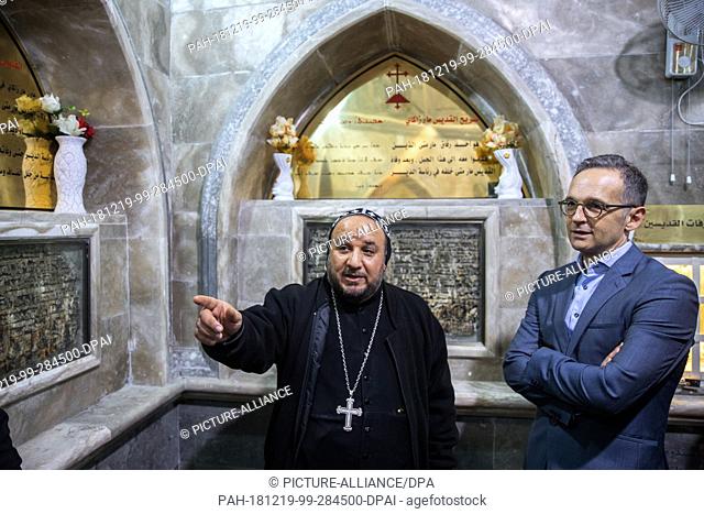 19 December 2018, Iraq, Erbil: Foreign Minister Heiko Maas (r, SPD) and Syrian Orthodox Archbishop Thimotheus Alshamany visit Morattai Monastery near Mossul in...