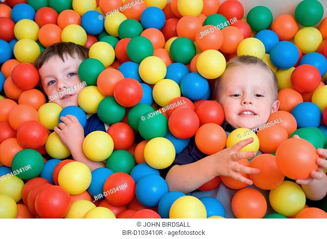 Boys playing in the ball pit at an early start nursery, ran by the Nottingham Royal Society for the Blind NRSB