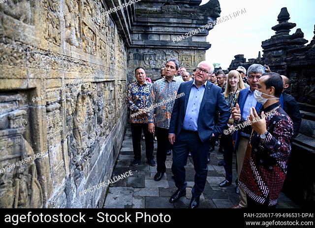 17 June 2022, Indonesia, Yogyakarta: German President Frank-Walter Steinmeier is guided through the Borobudur temple complex by Nahar Cahyan Daru (r)