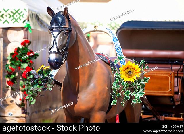 A beautiful plastic horse decorated with flowers