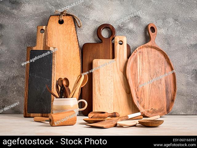 Collection of wooden kitchen utensils, kitchenware, cutting boards and spoons