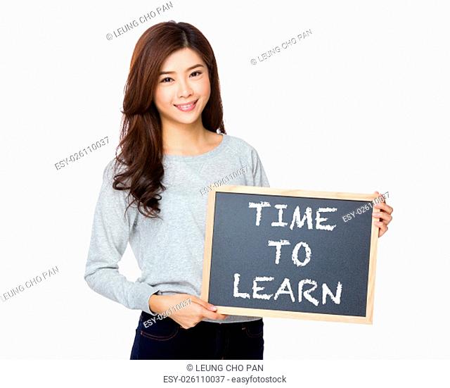 Asian woman hold with black board and showing phrase of time to learn