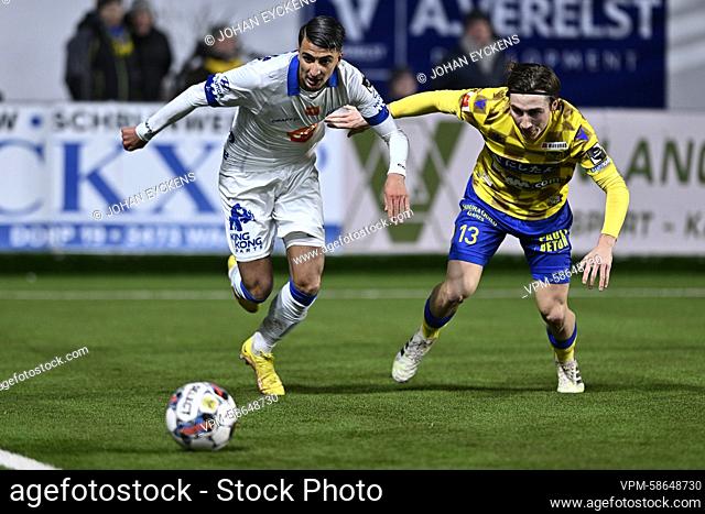 Gent's Ibrahim Salah and STVV's Rocco Reitz fight for the ball during a soccer match between Sint-Truidense VV and KAA Gent