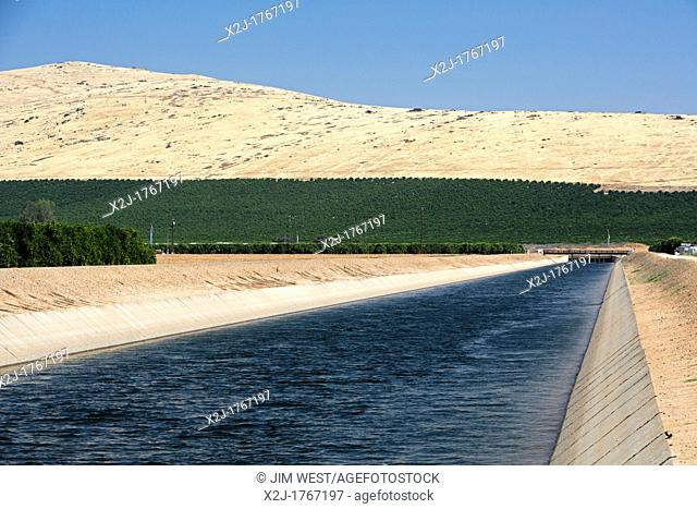 Woodlake, California - The Friant-Kern Canal, which transports irrigation water to the San Joaquin Valley  The orchard on the lower part of the hillside shows...