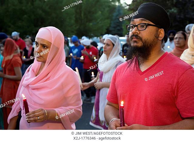 Plymouth, Michigan - Hundreds of Detroit-area Sikhs held a memorial service and candlelight vigil at the Hidden Falls Gurdwara temple for victims of the...