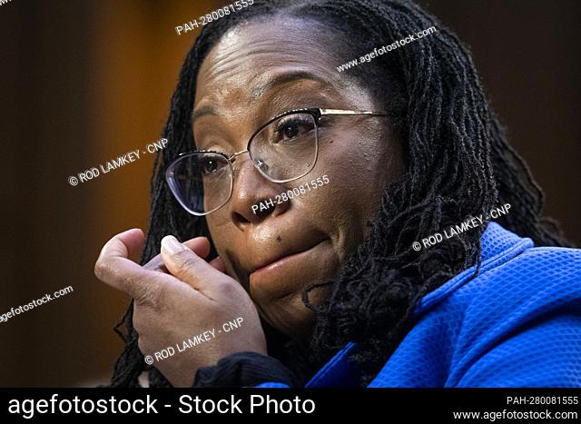 Judge Ketanji Brown Jackson wipes the tears from her face while listening to United States Senator Alex Padilla (Democrat of California) talk about how proud he...