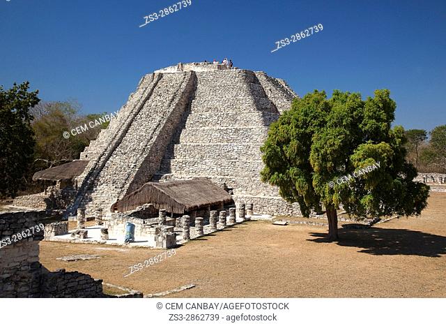 Visitors at the top of the Castle of Kukulcan-Castillo de Kukulcan in Mayapan Archaeological site, Merida, Yucatan State, Mexico, Central America